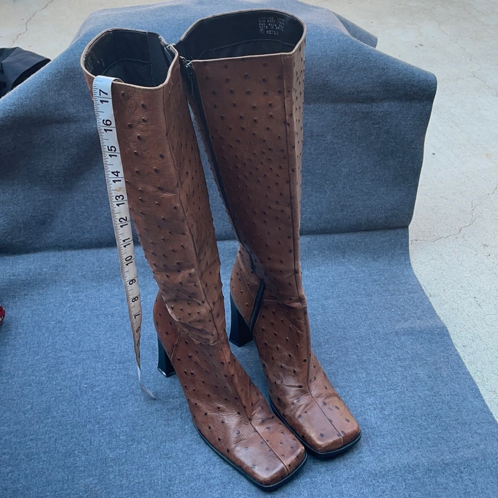 Nine West, leather ostrich embossed print high heel boots.
